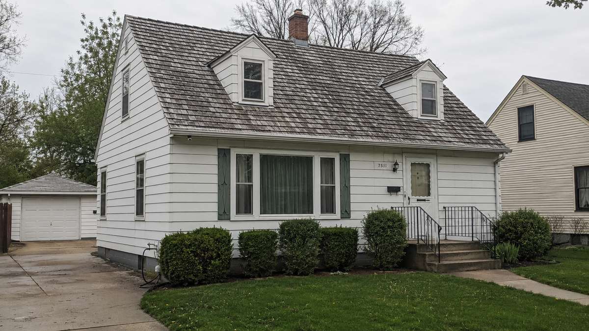 A weathered cedar shake roof on a home in the Milwaukee area