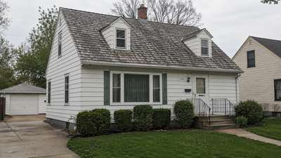 A weathered cedar shake roof on a home in the Milwaukee area