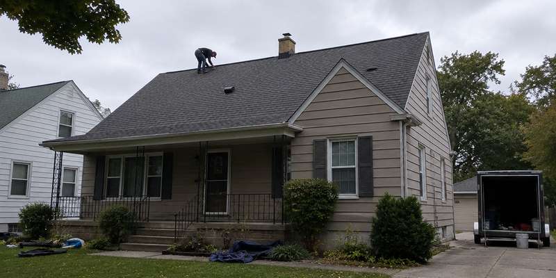 A completed asphalt shingle roof on a Milwaukee-area home