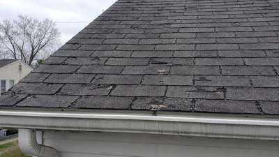 A worn asphalt shingle roof in Milwaukee showing signs of age