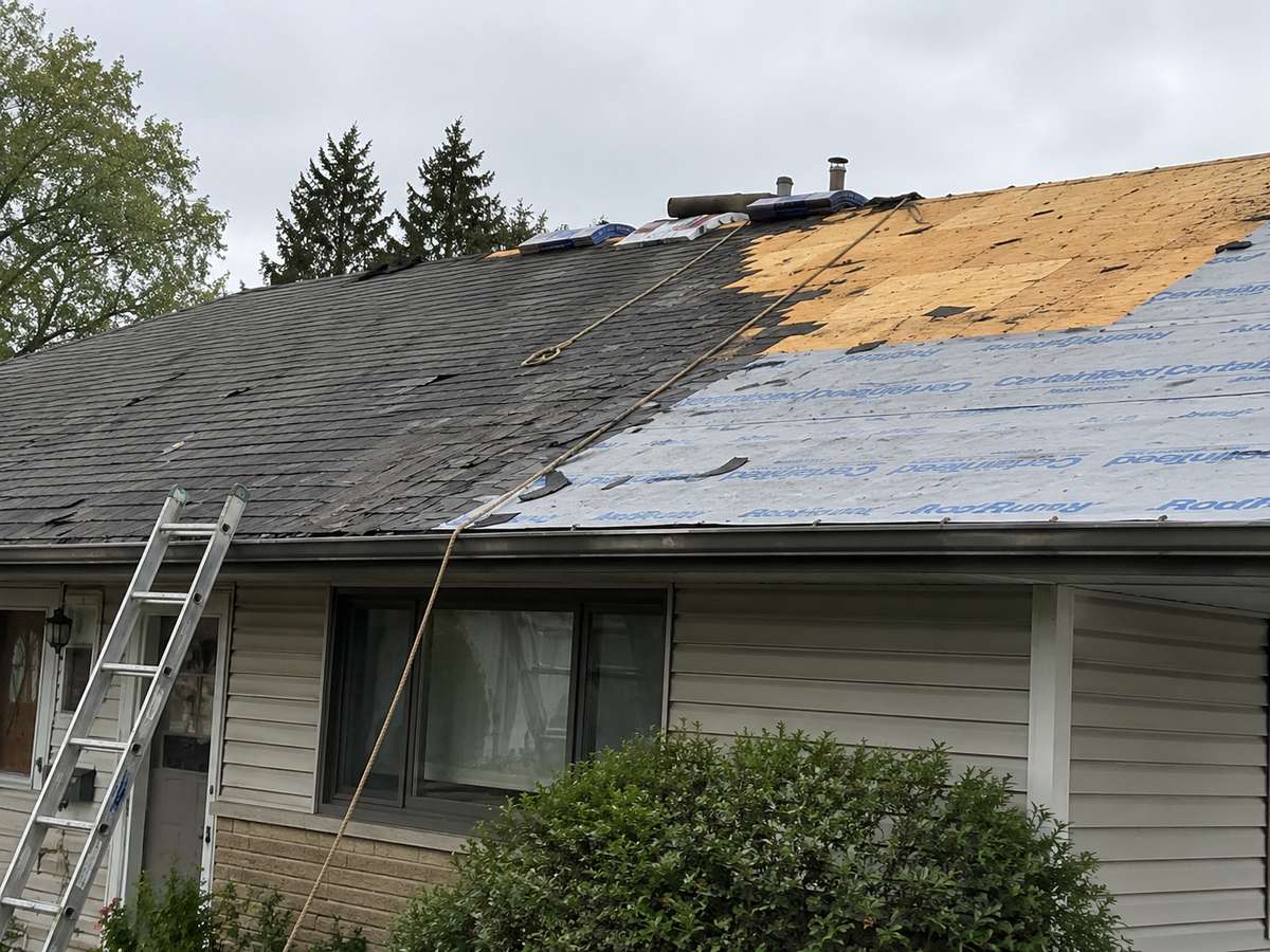 A roof mid tear-off during a re-roofing project on a Milwaukee-area home